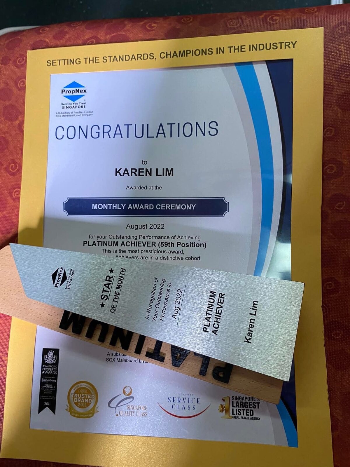 Karen Lim’s Platinum Achiever certificate and Star of the Month plaque for August 2022