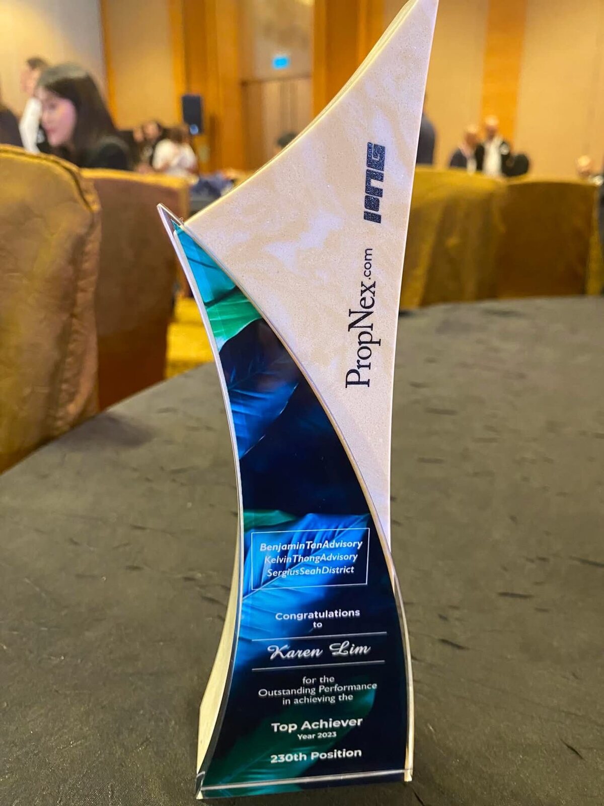 The PropNex Top Achiever trophy awarded to Karen Lim for 2023