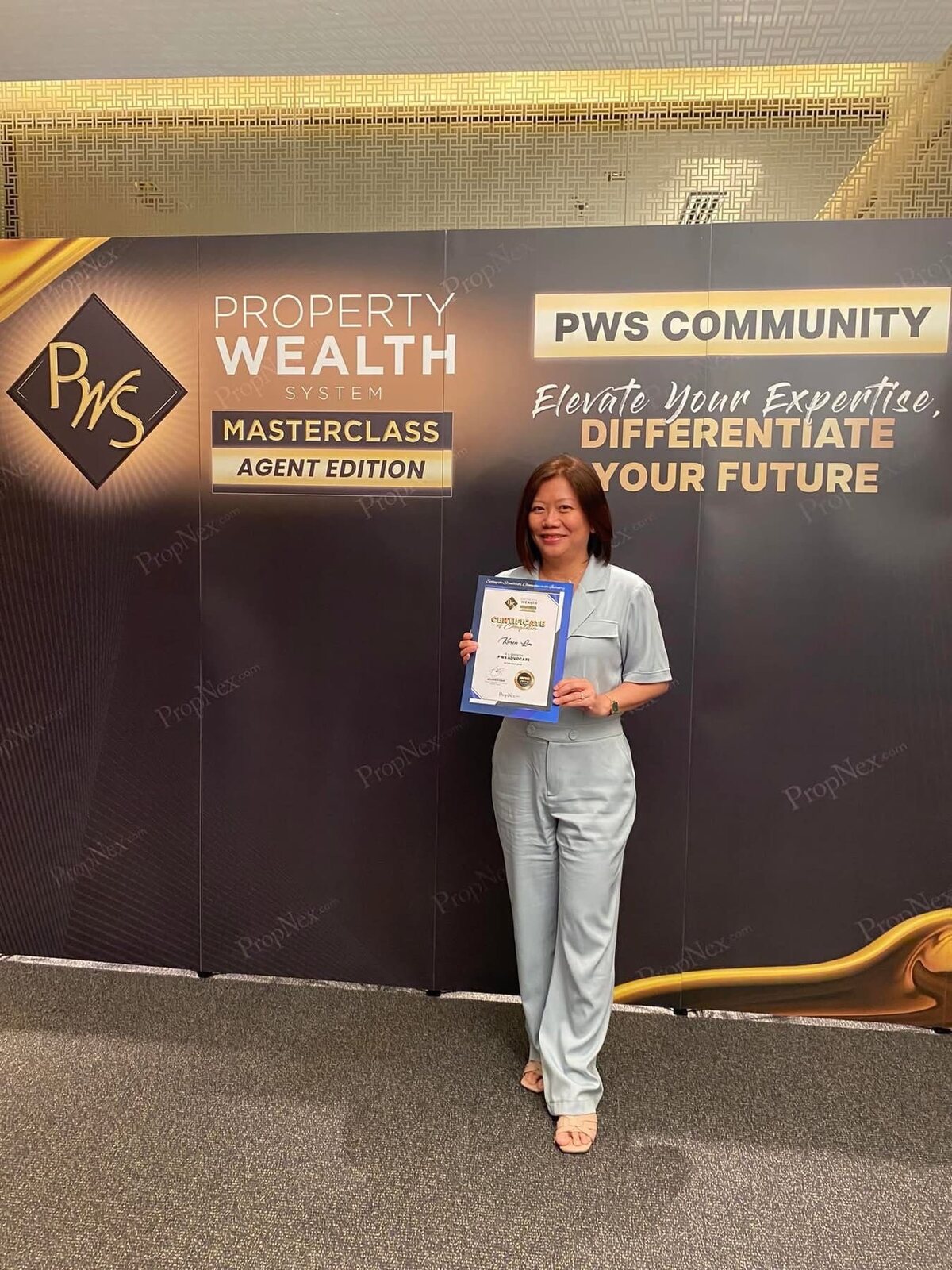 Karen Lim with her certificate at a Property Wealth Masterclass